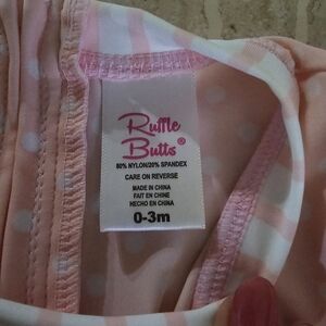 Ruffle Butt's...pink polkadot one piece rashguard 0-3m